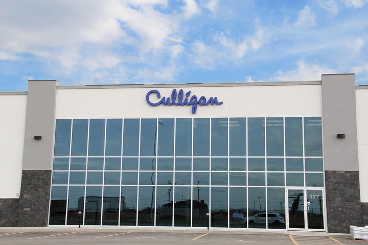 Alumicor 2500 series curtain wall C/W PPG solarblue on solarban 60.